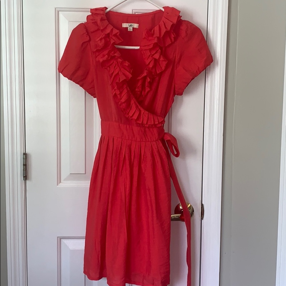 Coral wrap dress with ruffles